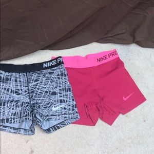 two pair nike pros size small